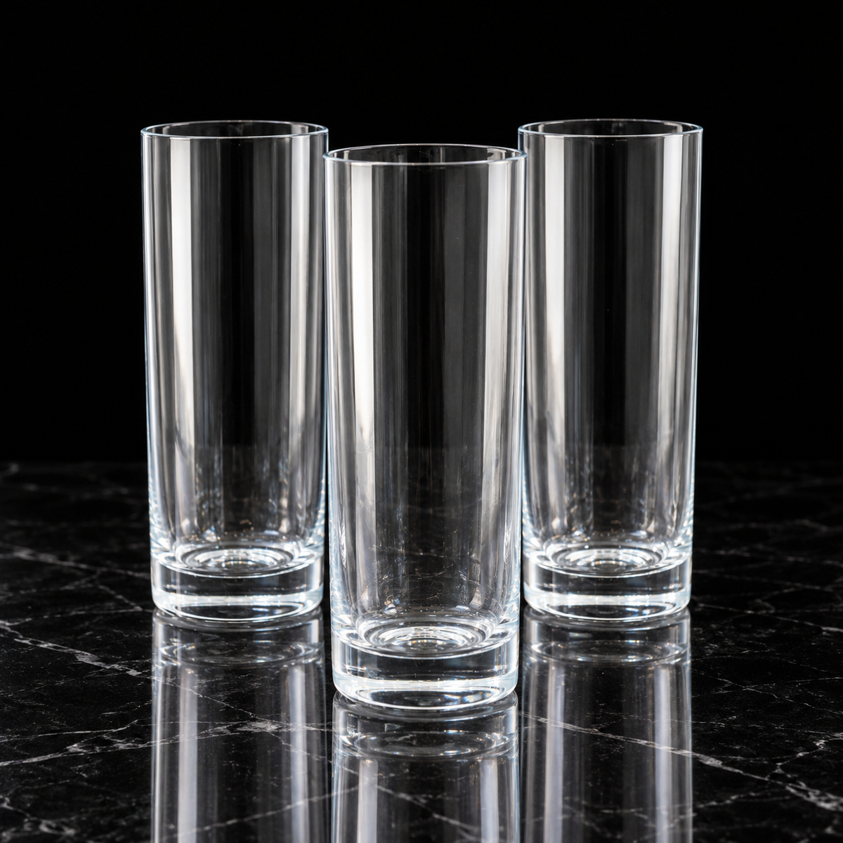 Highball glasses on black marble
