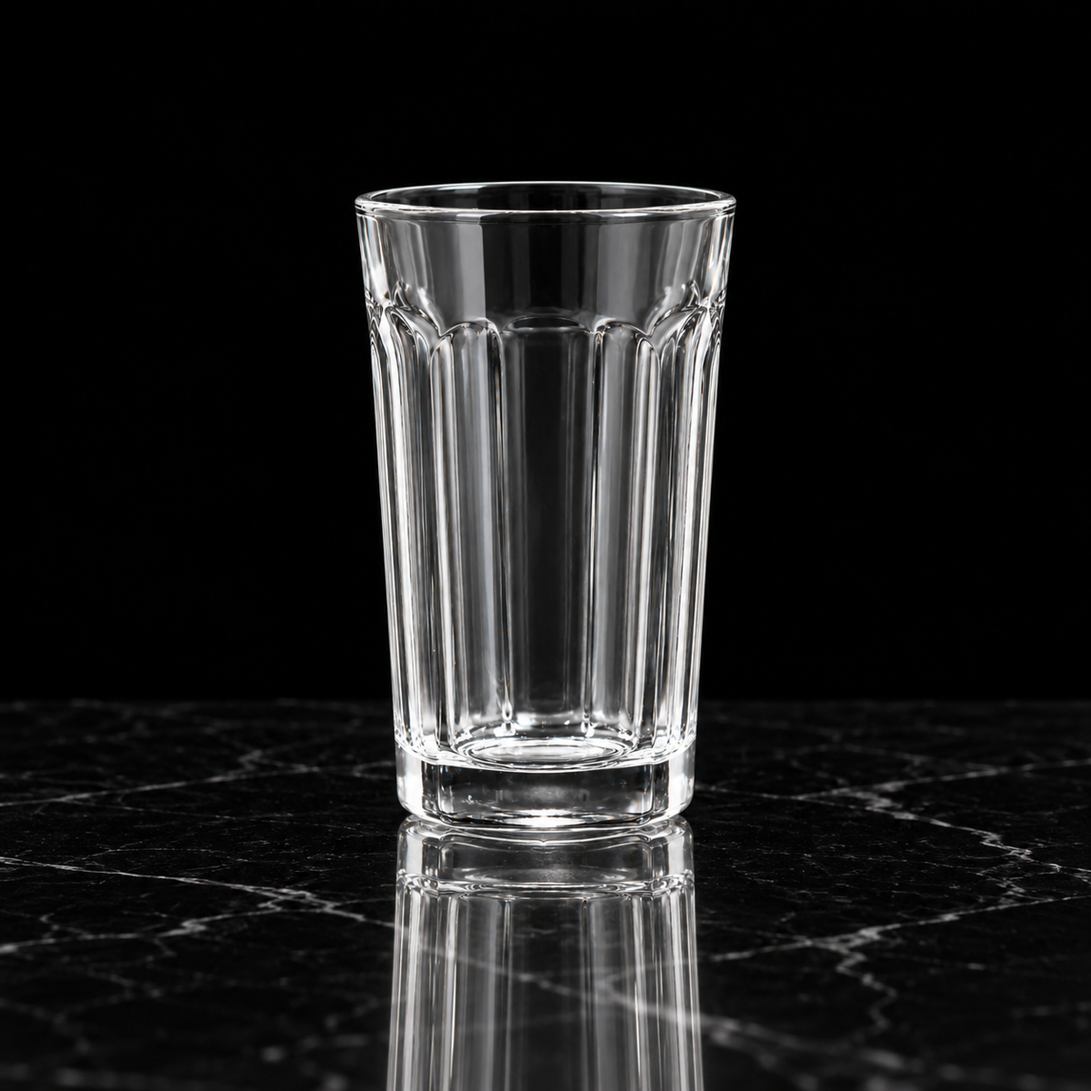 T-304 fluted highball glass on black marble