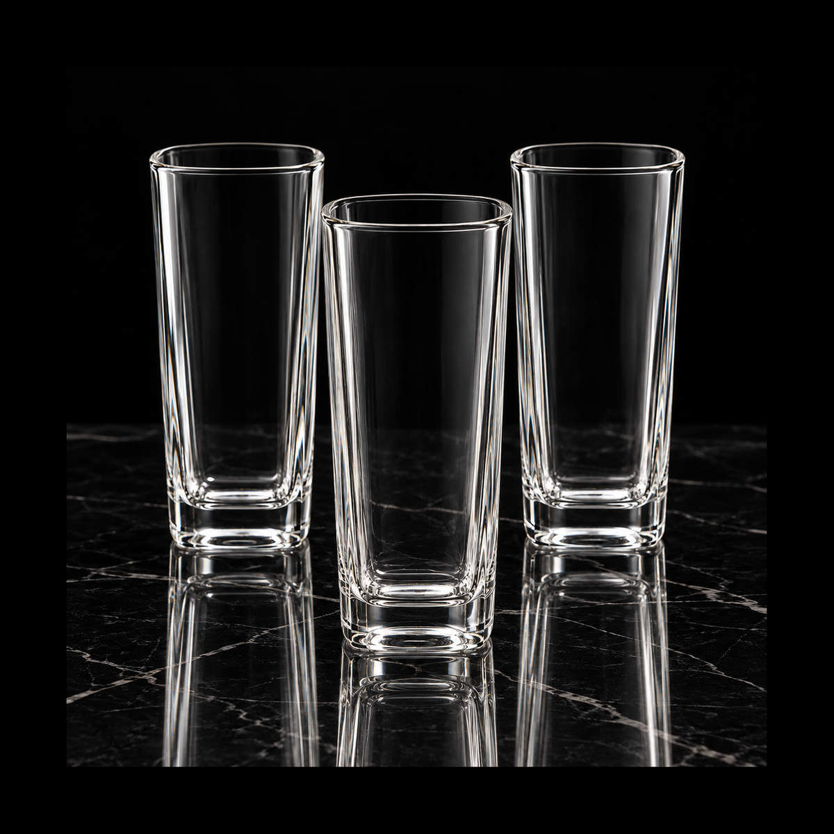 Highball glasses on black marble