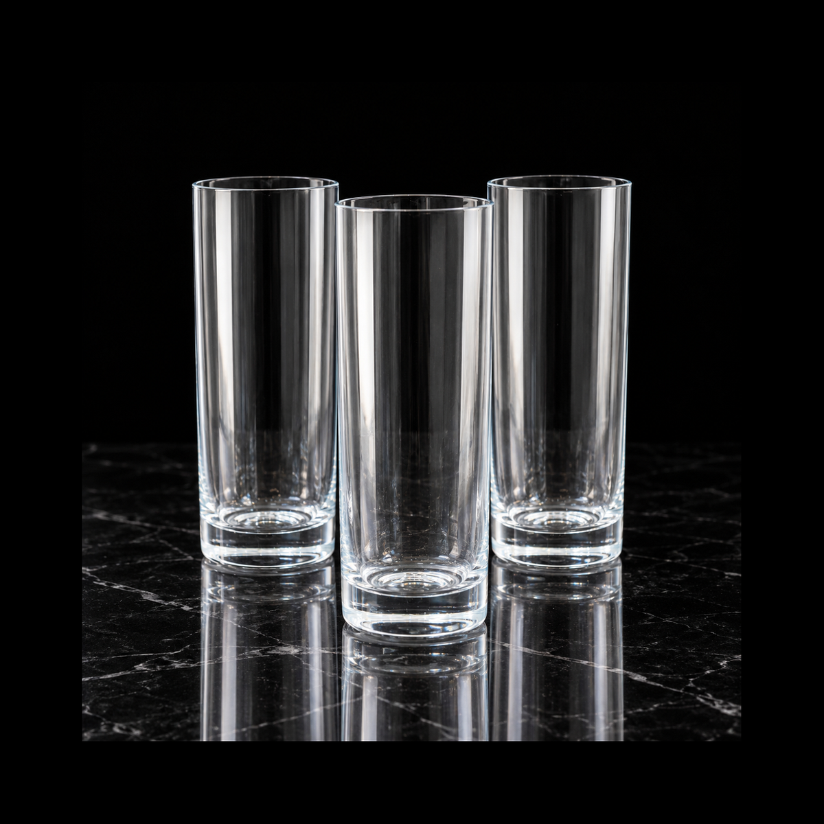Tall glasses on black marble