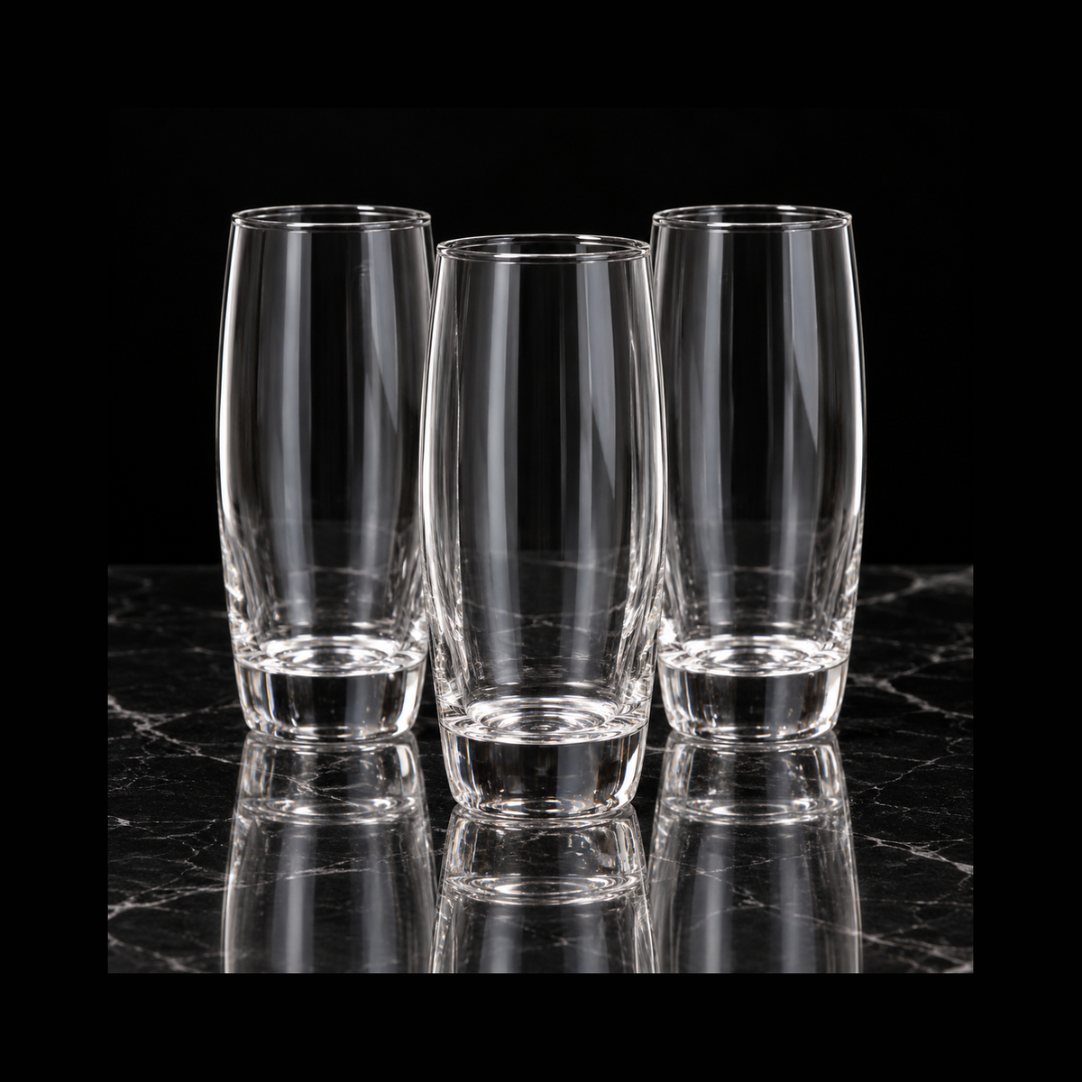 Highball glasses on black marble