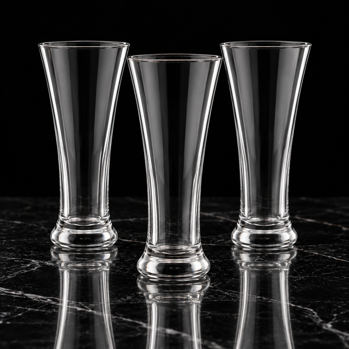 Tall beverage glasses on black marble