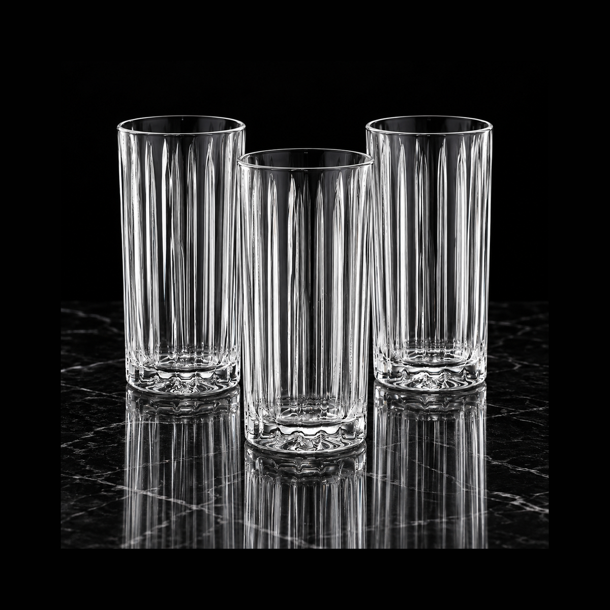 Highball glasses on black marble