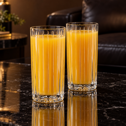 Highball glasses with orange juice in living room